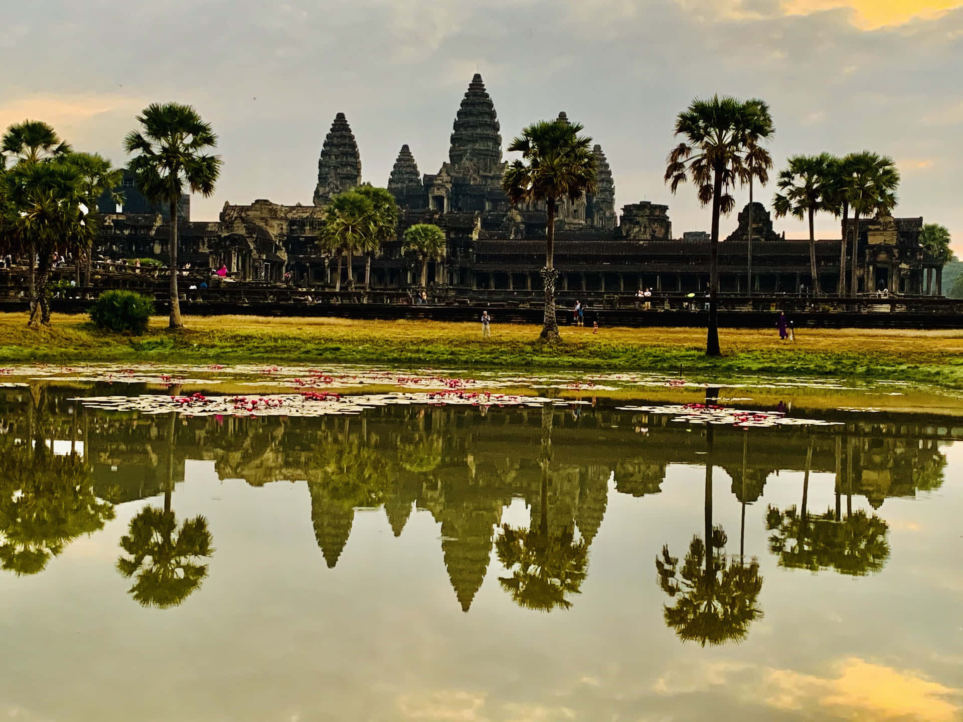 Majestic Reflection of Angkor Thom in Water Wallpaper