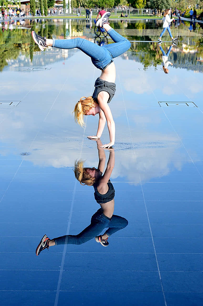 Woman Reflection Doing Handstand Picture