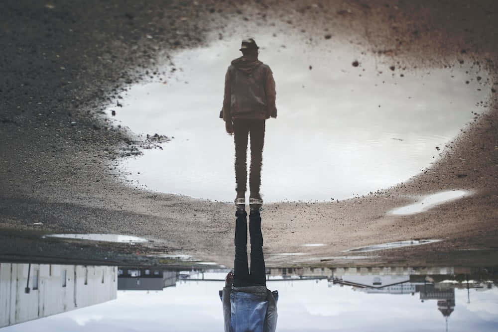 Man Reflection In Puddle Picture