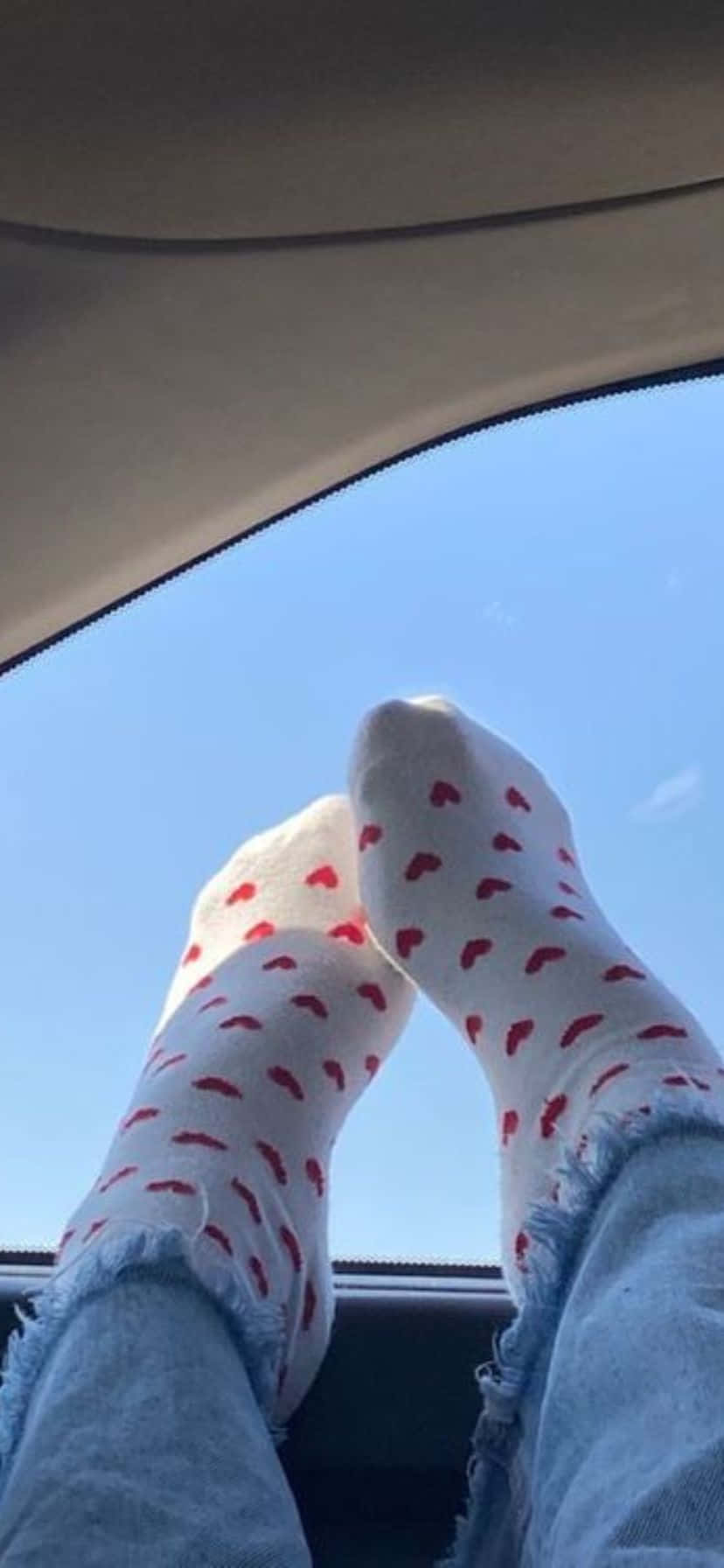 Relaxed_ Feet_with_ Heart_ Socks_in_ Car Wallpaper
