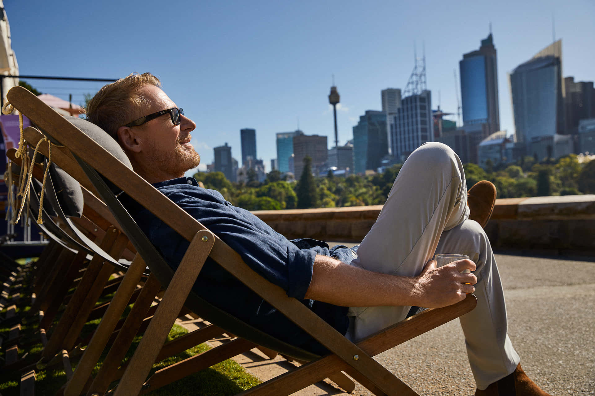 Relaxed Man Enjoying City View Sunshine Wallpaper