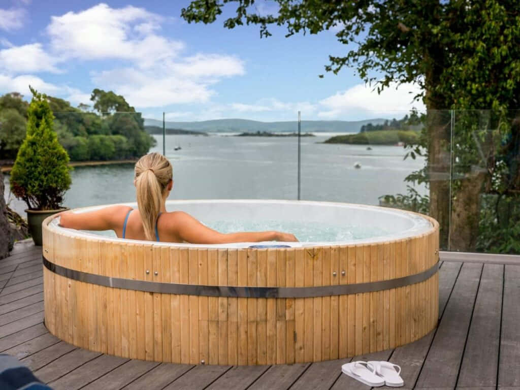 Relaxing Lakeside Hot Tub Experience Wallpaper