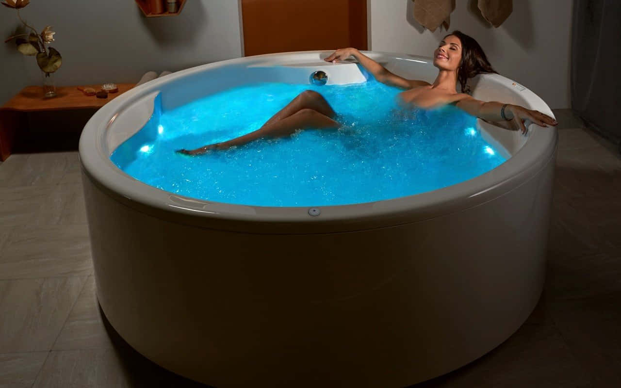 Relaxing Womanin Lit Hot Tub Wallpaper