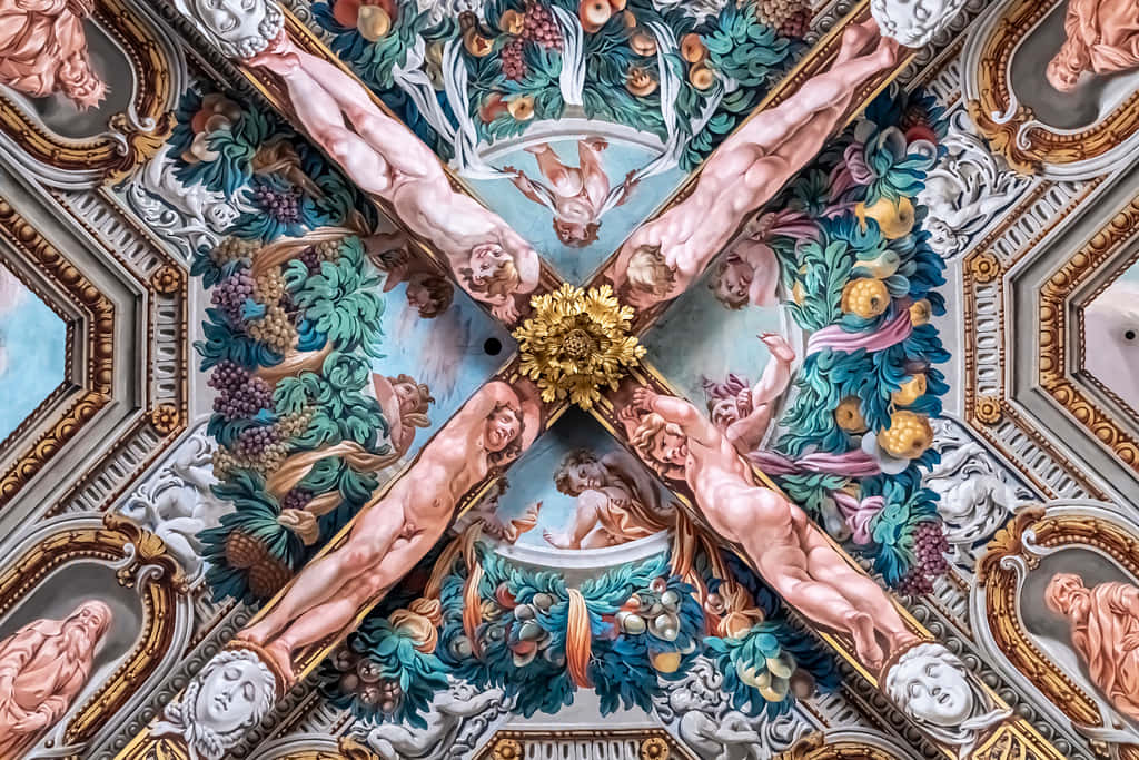 The Ceiling Of A Church With A Cross Painted On It Wallpaper