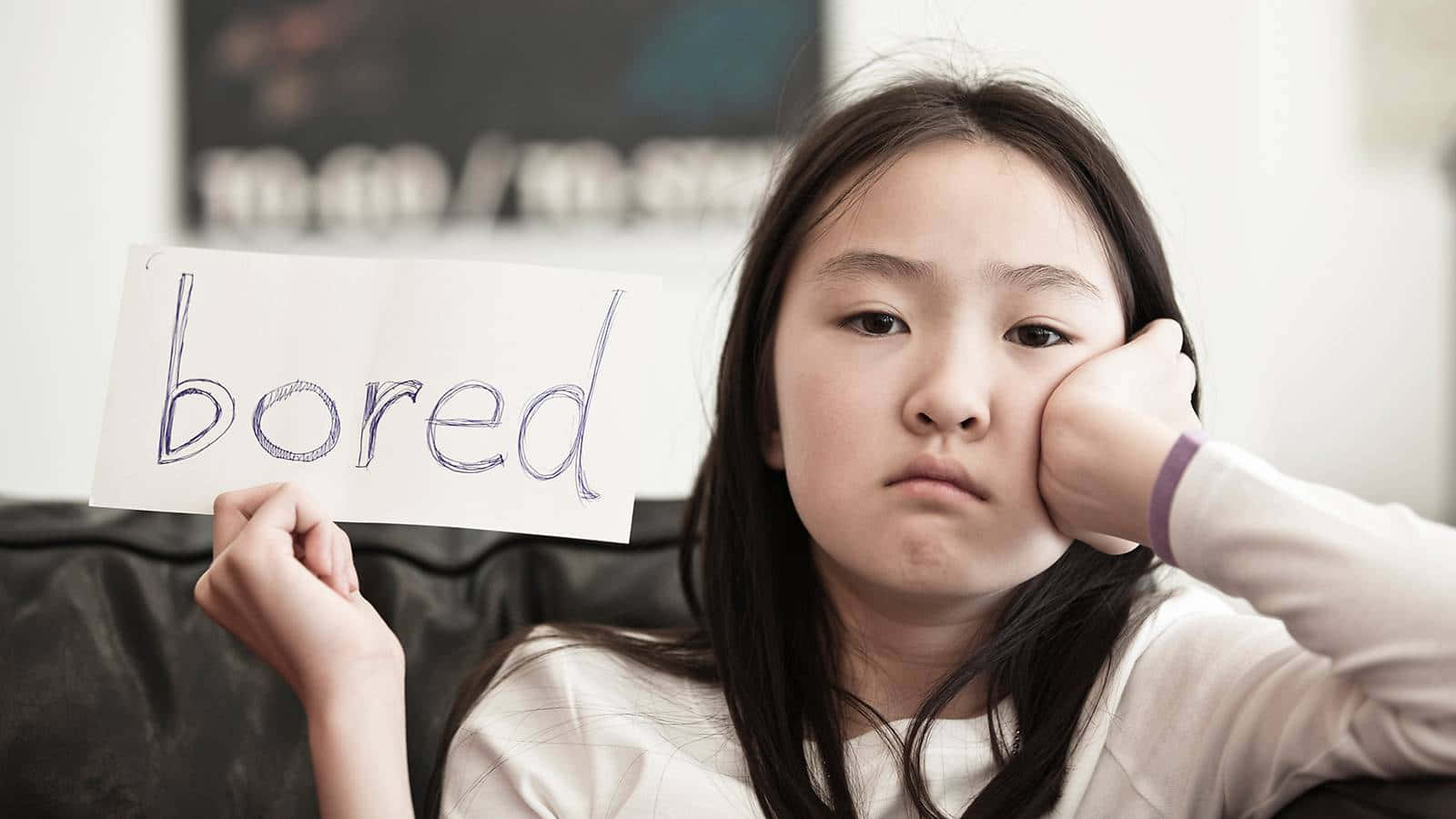 Young Girl Expressing Reluctance and Boredom Wallpaper