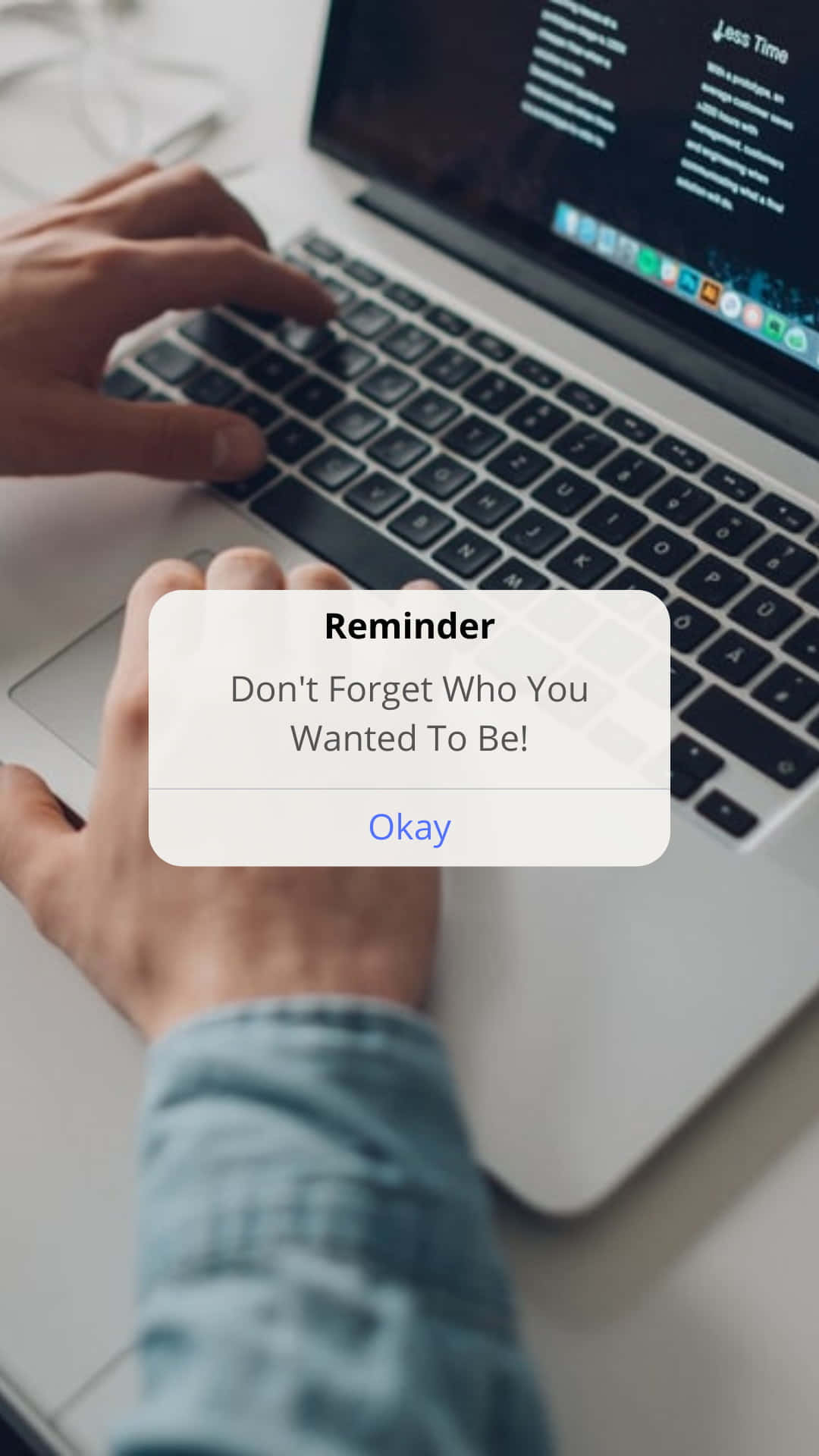 A Person Using A Laptop With The Text Reminder Don't Forget Who You Wanted To Be