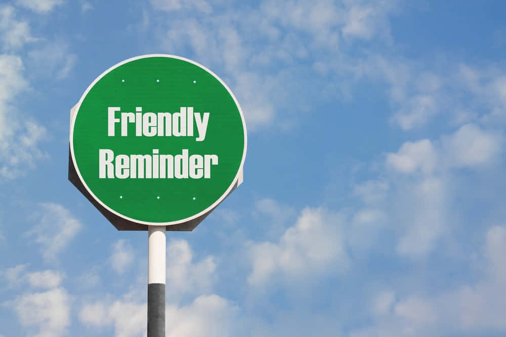 A Green Sign That Says Friendly Reminder