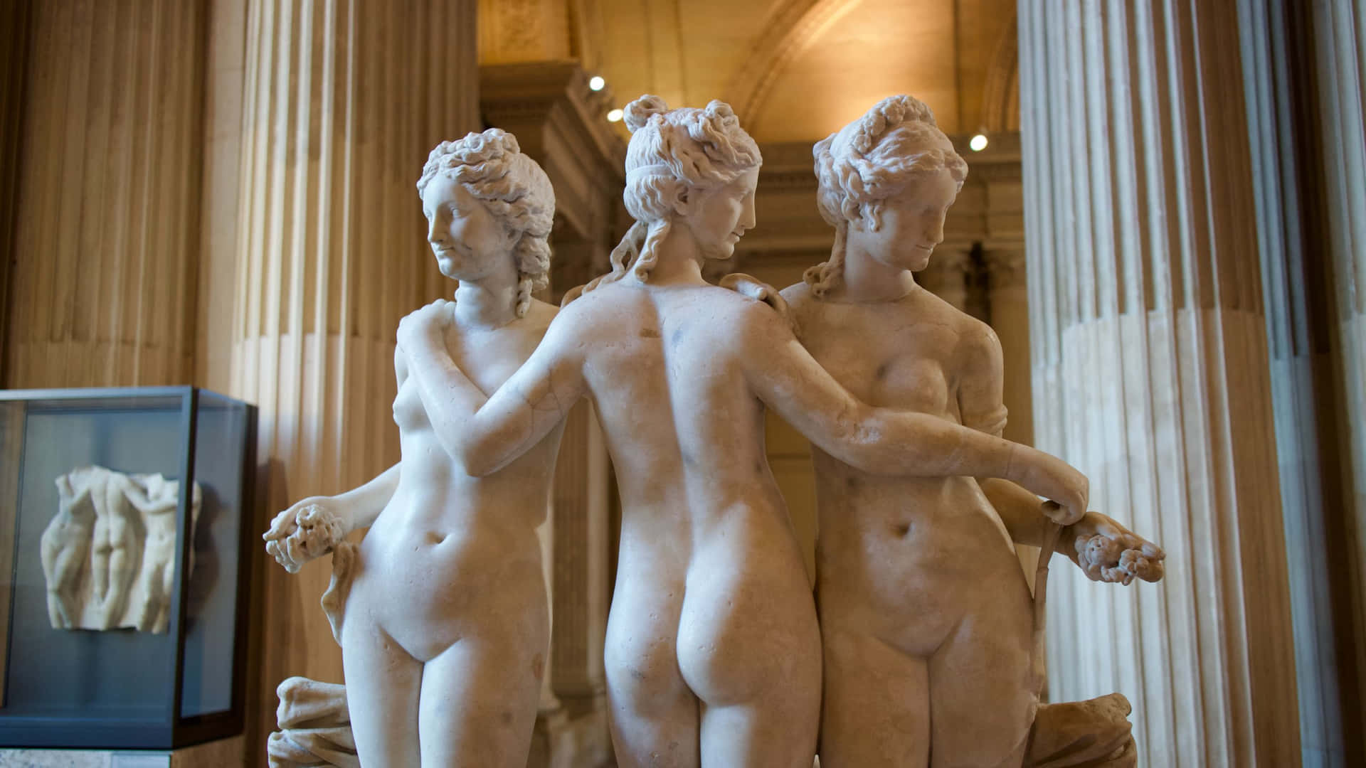 Three Statues Of Nudes In A Museum