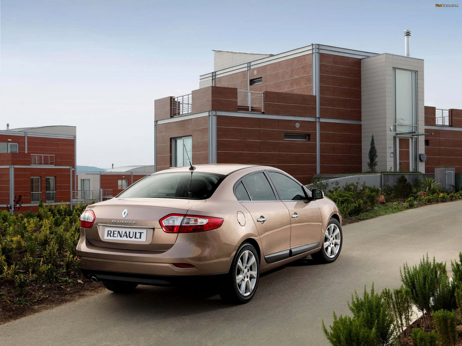 Sleek and Stylish Renault Fluence on the Road Wallpaper