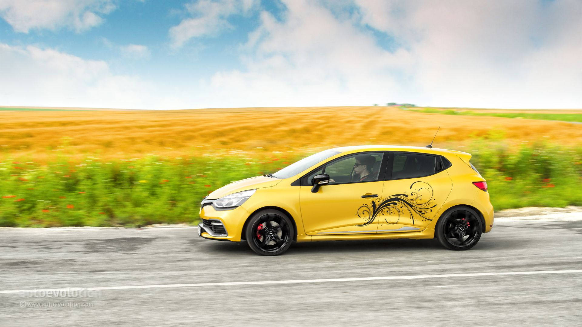 Renault In Yellow Fields Wallpaper