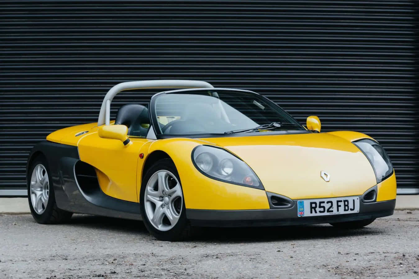 Sleek Renault Sport Spider on the Open Road Wallpaper