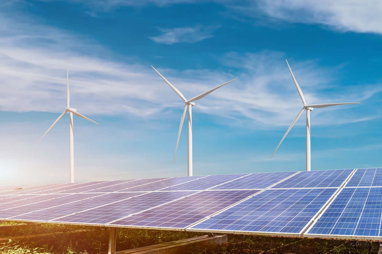 Solar panels and wind turbines against a scenic backdrop Wallpaper