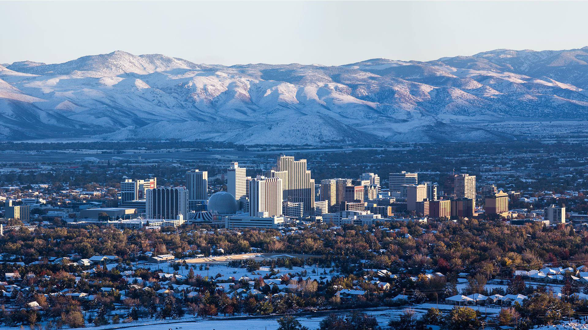 A crystal clear winter sky illuminates Reno's iconic skyline. Wallpaper