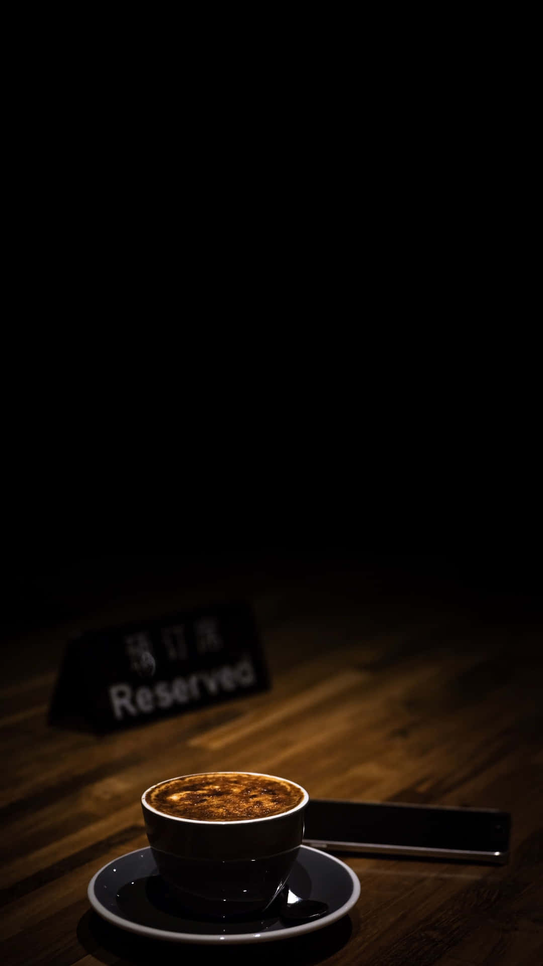 Reserved Sign on Table at Coffee Shop Wallpaper