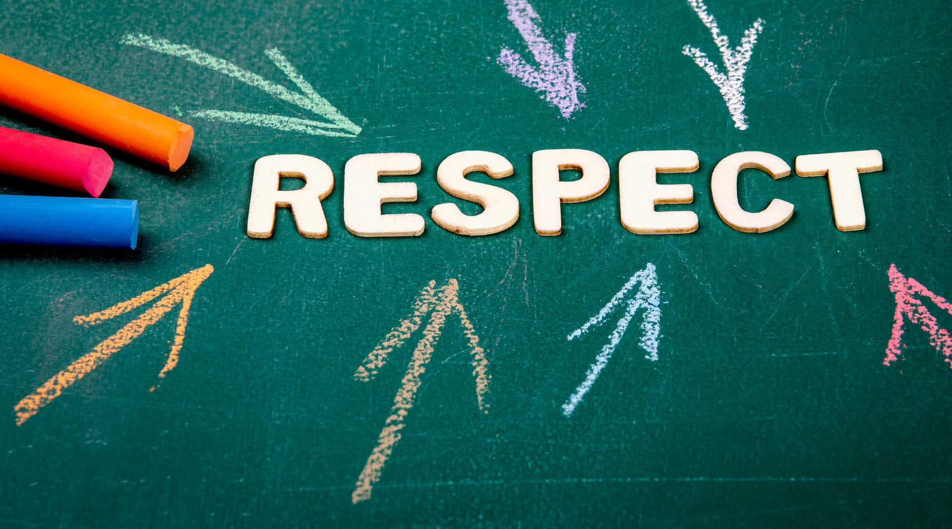 respect written on a blackboard with colored chalk