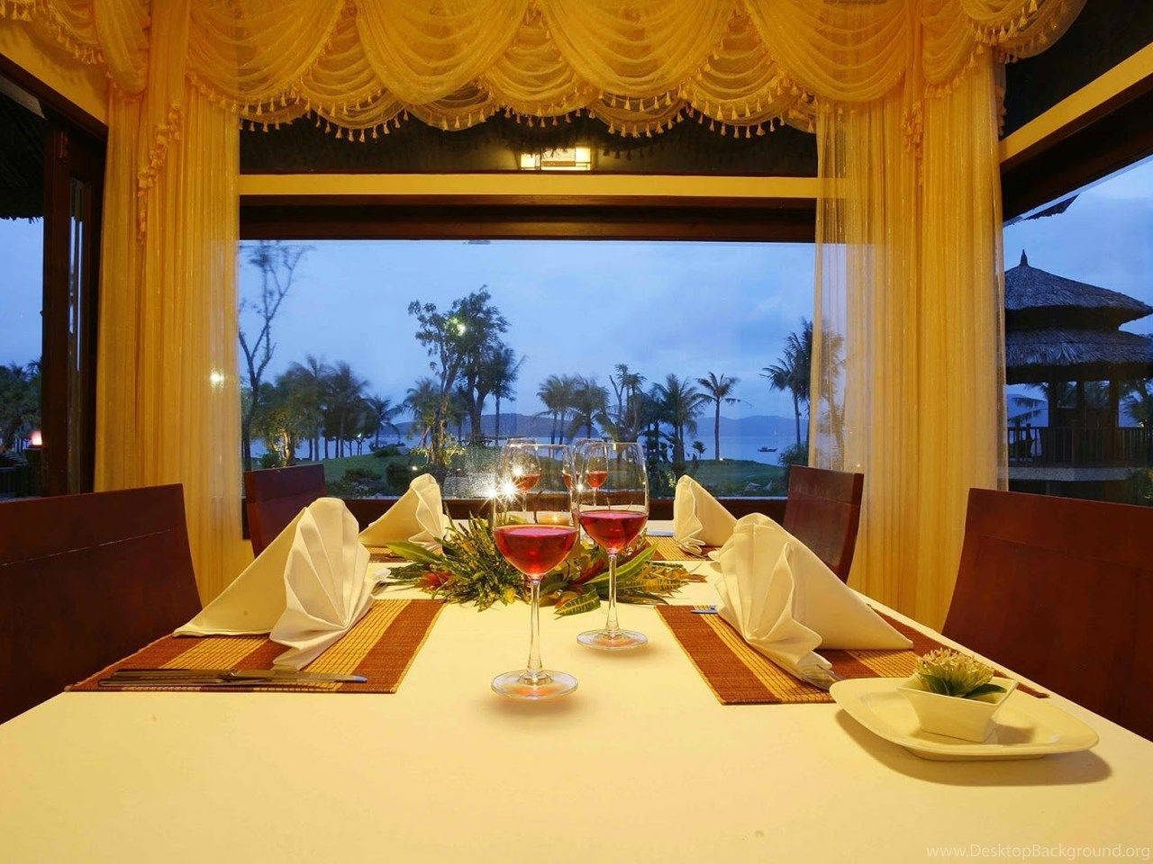 Restaurant Overlooking Coconut Trees And Mountains Wallpaper