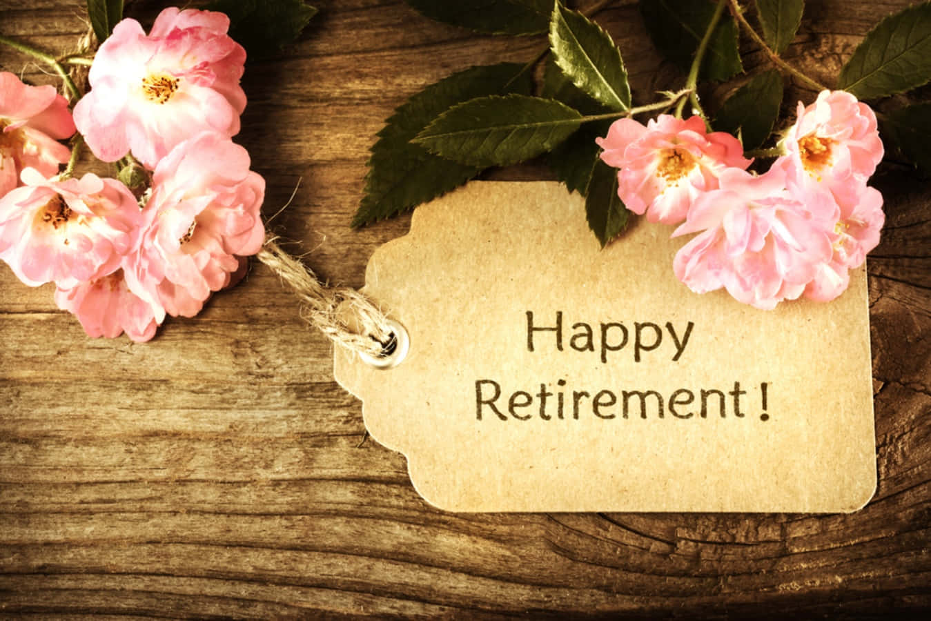 Happy Retirement Card With Flowers On A Wooden Background