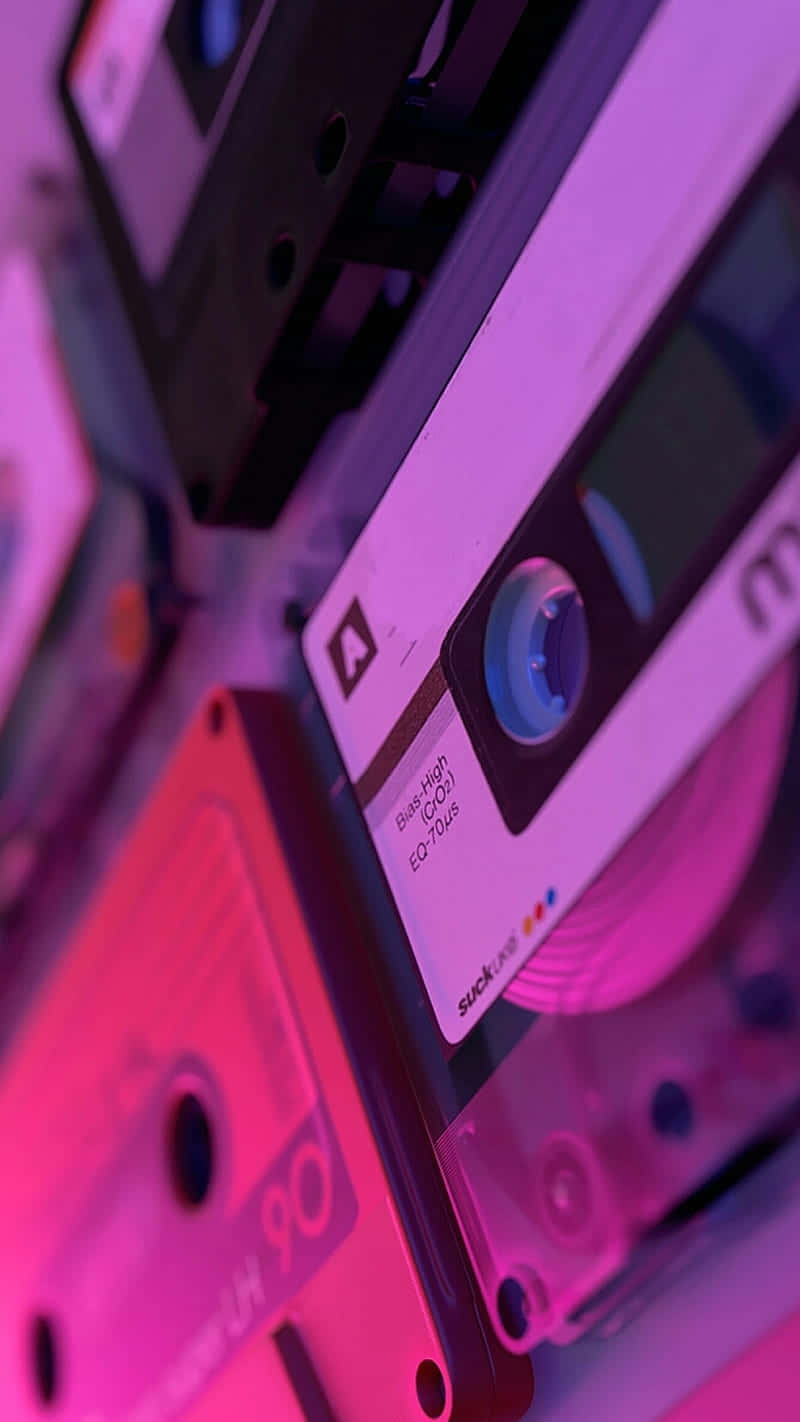 Retro Cassette Tapes Pink Blue Glow Wallpaper