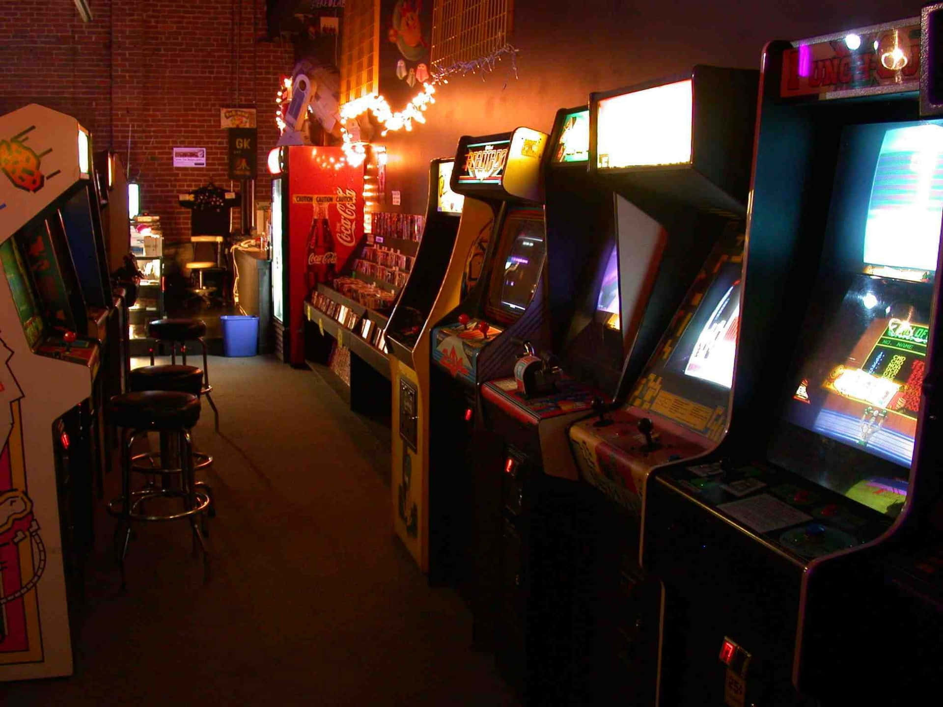 A Row Of Video Game Machines Wallpaper