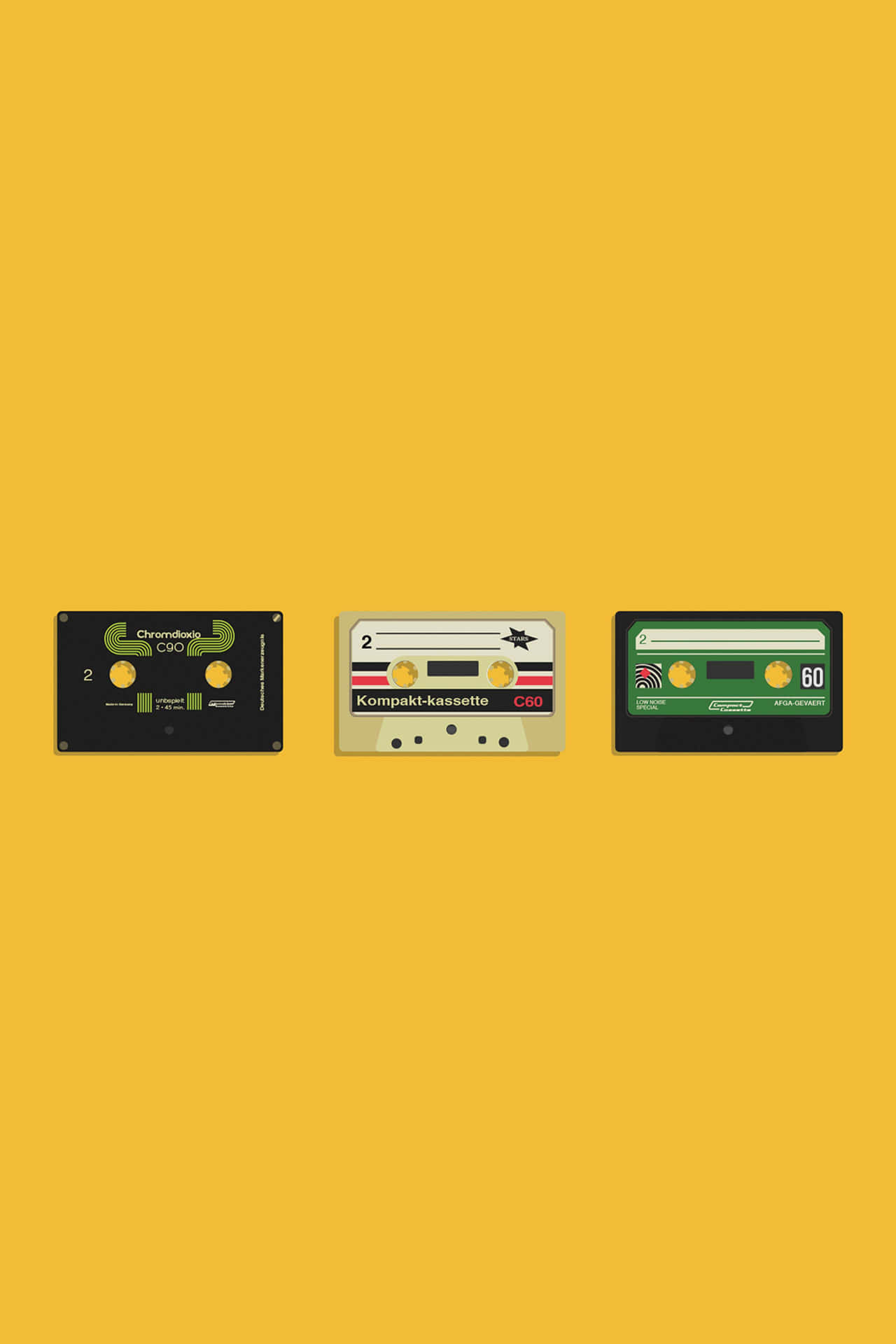 Four Cassettes On A Yellow Background Wallpaper