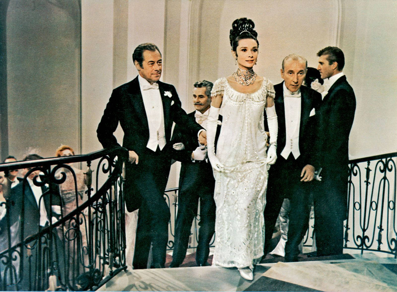 Rex Harrison Looking At Audrey Hepburn In A Ball Wallpaper