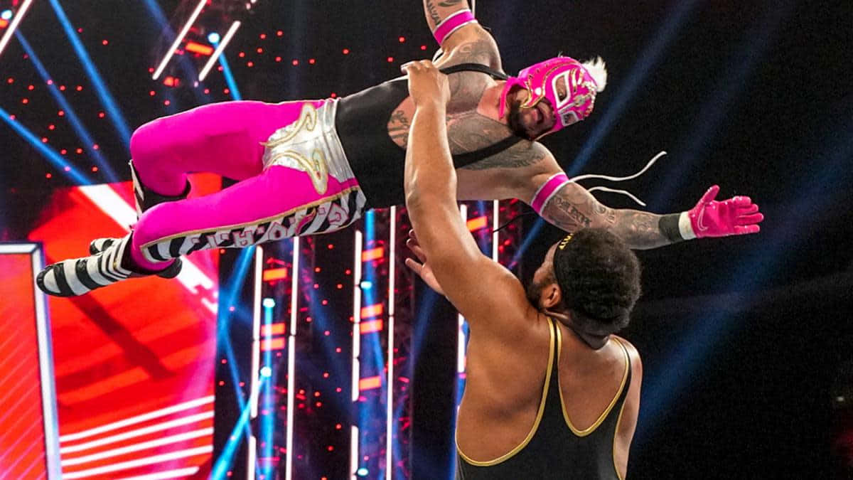 Rey Mysterio Mid Air Attack Wrestling Match Wallpaper