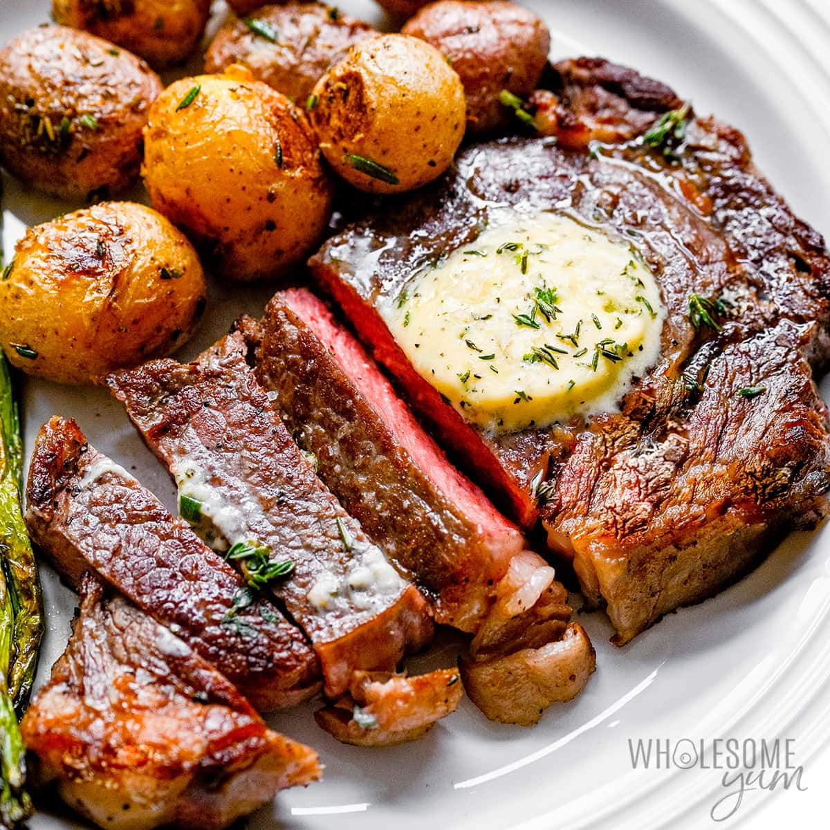 A Plate With Steak, Potatoes And Butter