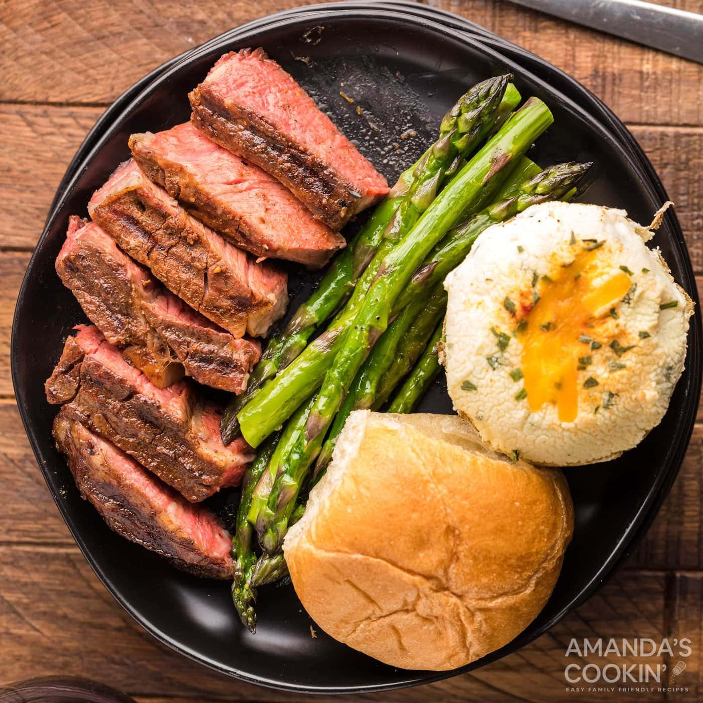 Steak With Eggs And Asparagus On A Plate