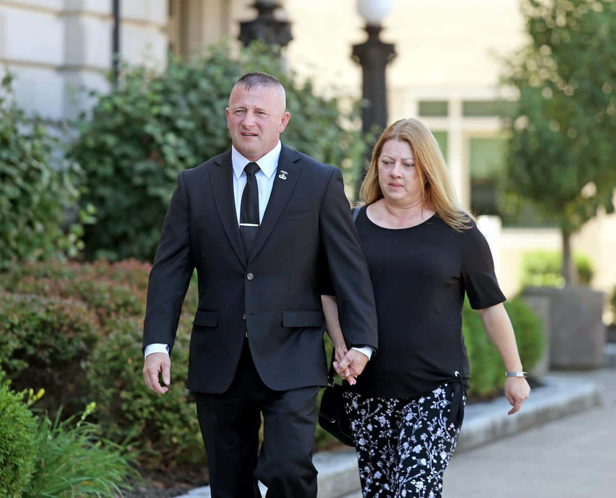 Caption: Richard Ojeda Holding Hands with Wife Wallpaper