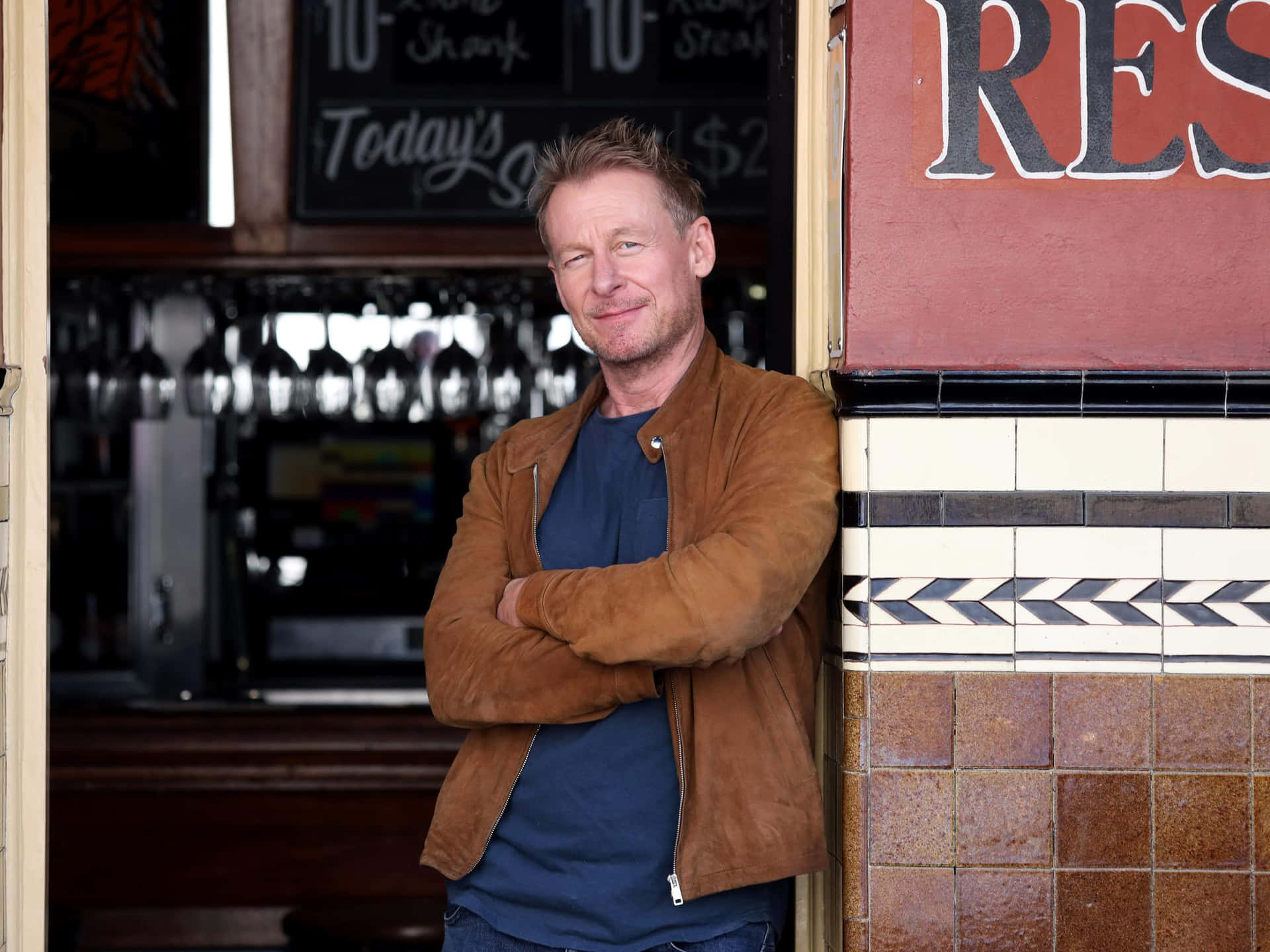 Richard Roxburgh Smiling Near Restaurant Wallpaper