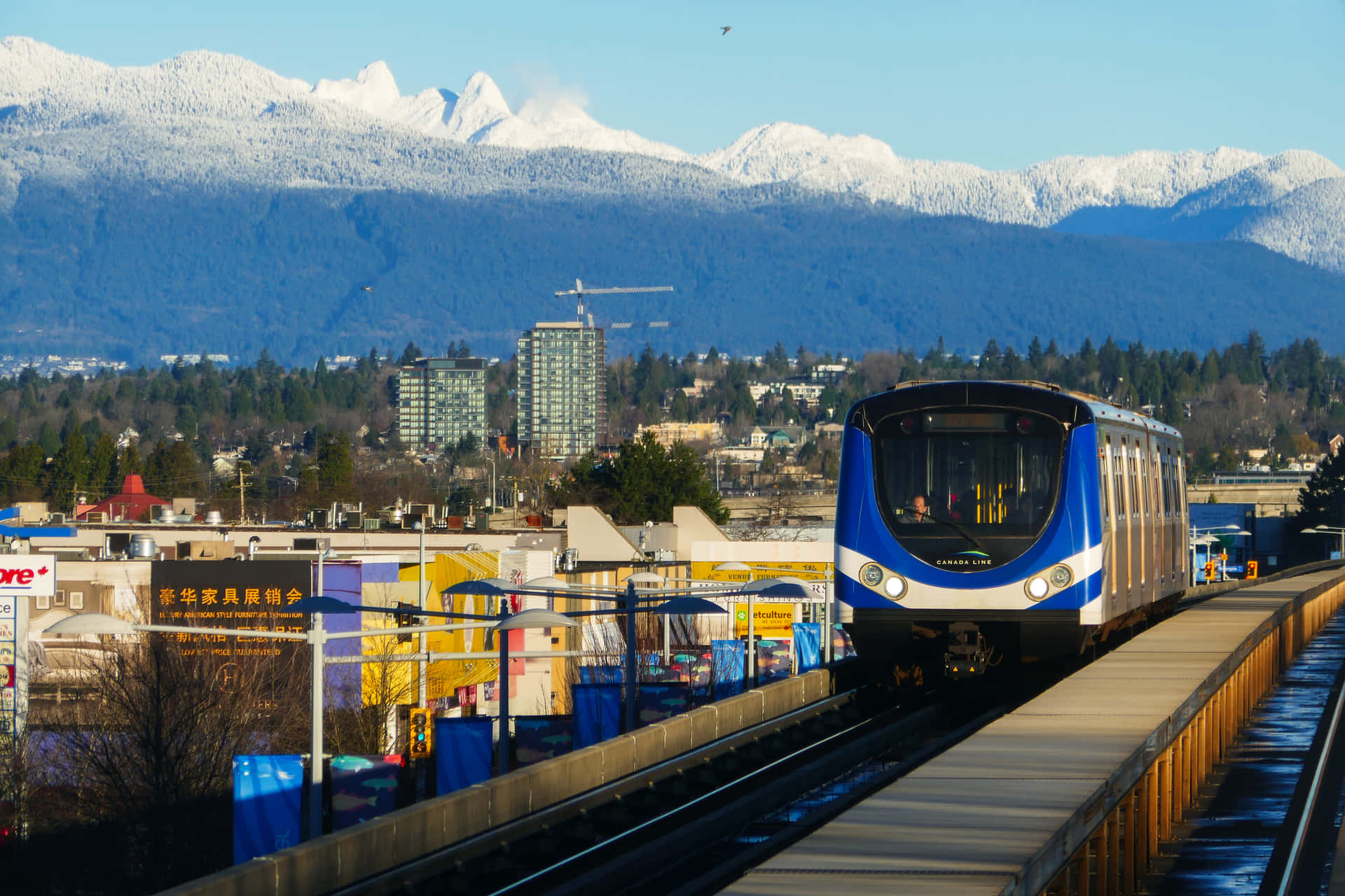 Richmond Canada Sky Trainwith Mountain Backdrop Wallpaper