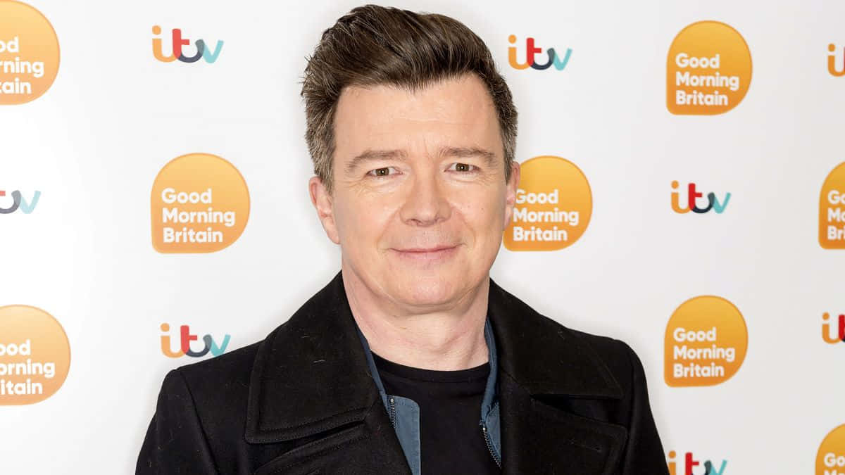 Rick Astley singing on stage Wallpaper
