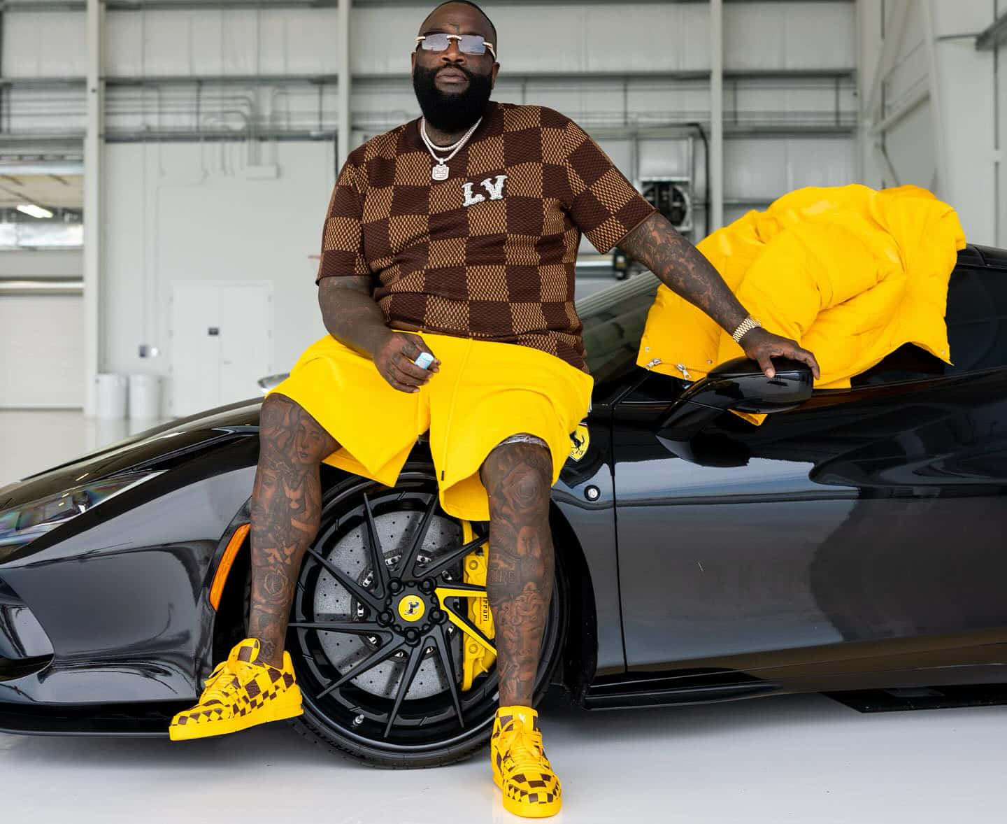 Rick Ross Stylish Pose With Sports Car Wallpaper