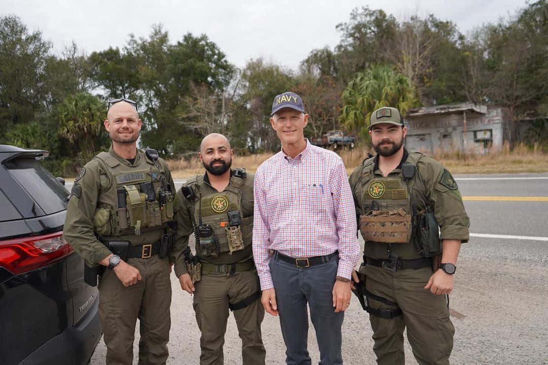 Florida Governor Rick Scott interacts with local Sheriffs Wallpaper