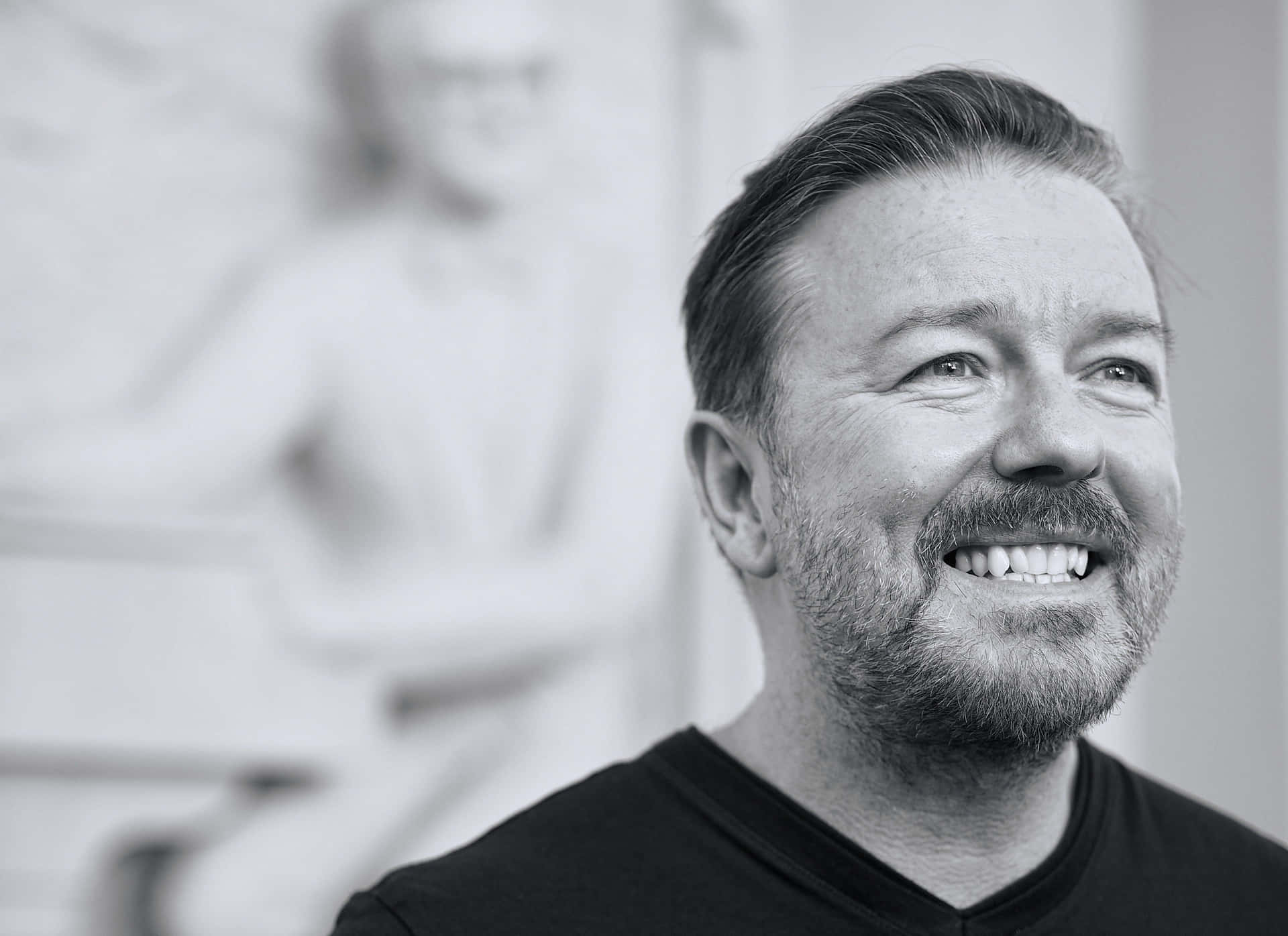 Ricky Gervais, Bringing Laughter and Joy to Millions Wallpaper