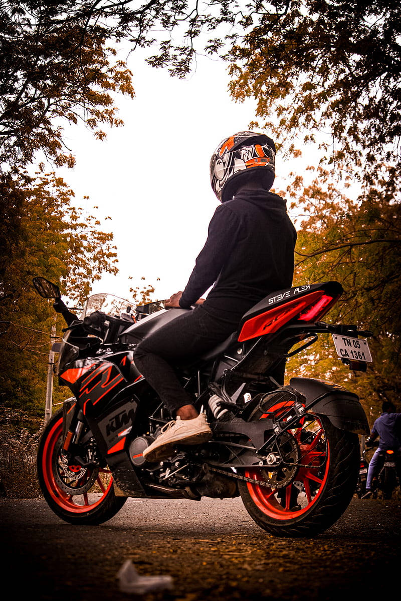 Rider On Red Ktm Rc 200 Wallpaper