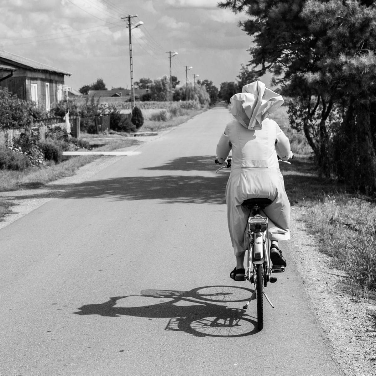 Riding Bike Nun Wallpaper