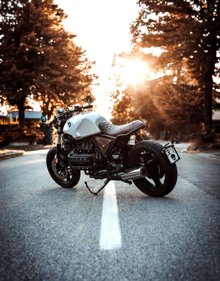 Riding Bmw Motorcycle On An Open Road Wallpaper
