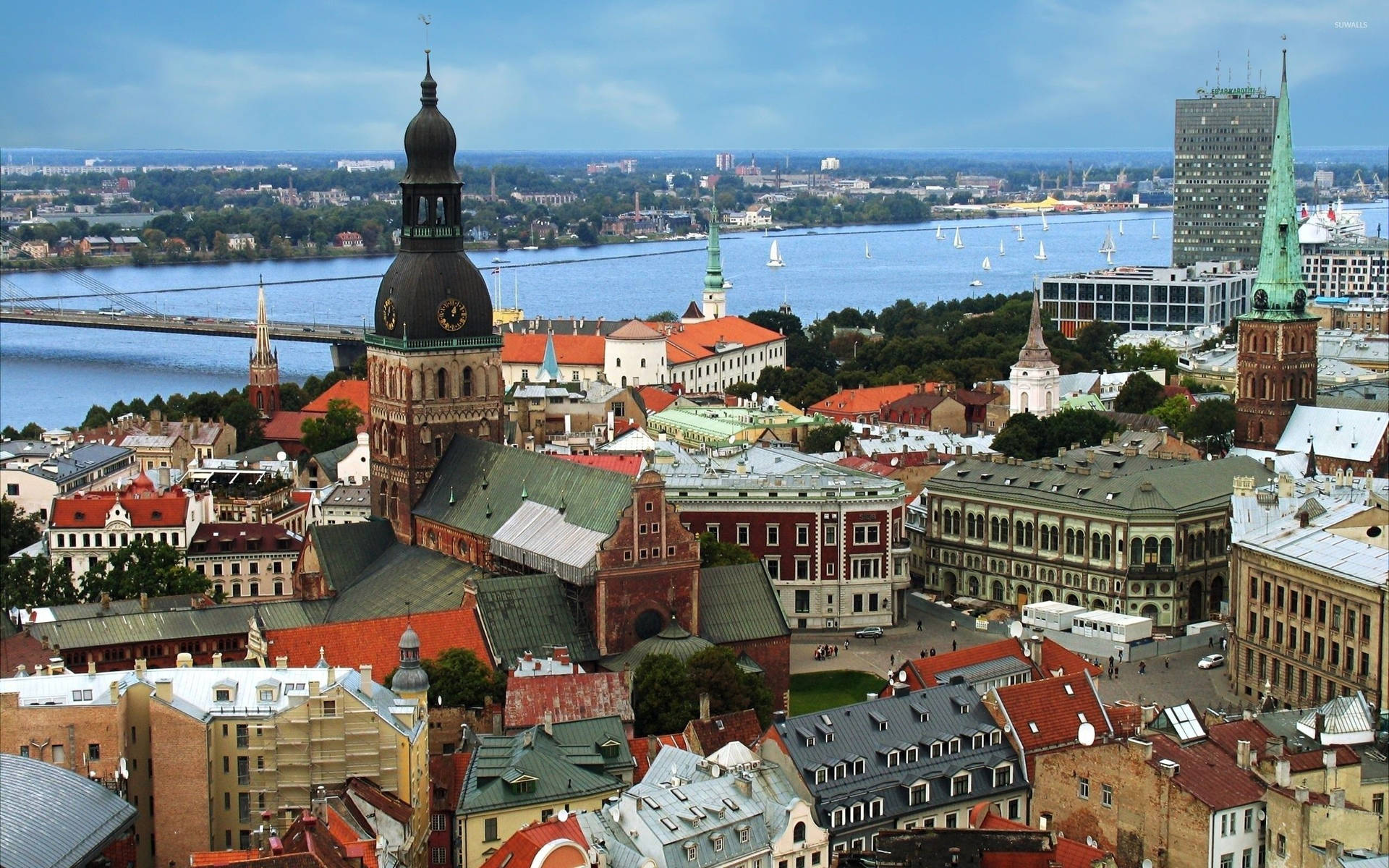 Riga Cathedral And St. Peter's Church In One Photo Wallpaper