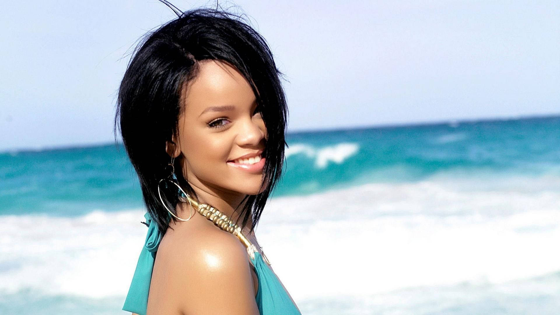 Songstress Rihanna strikes a pose in a stunning beach photo shoot Wallpaper