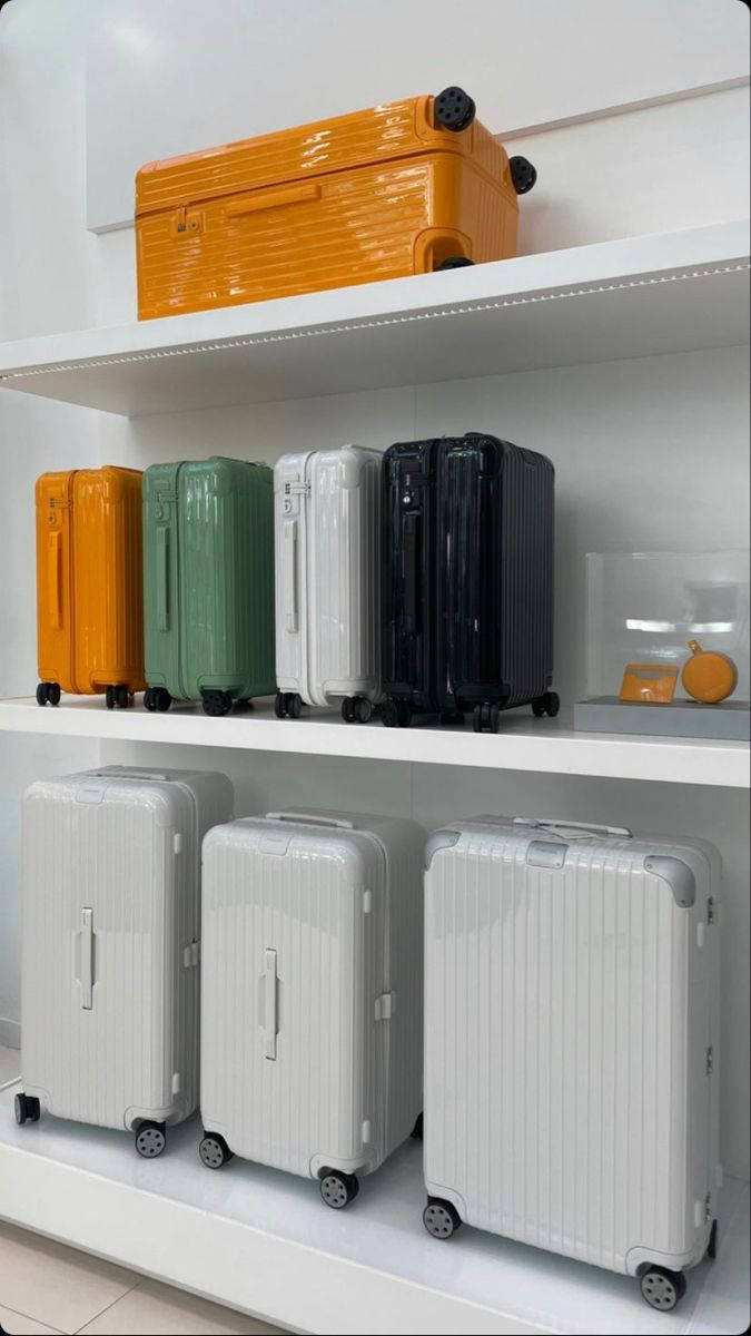 Rimowa Suitcases On Shelves Wallpaper