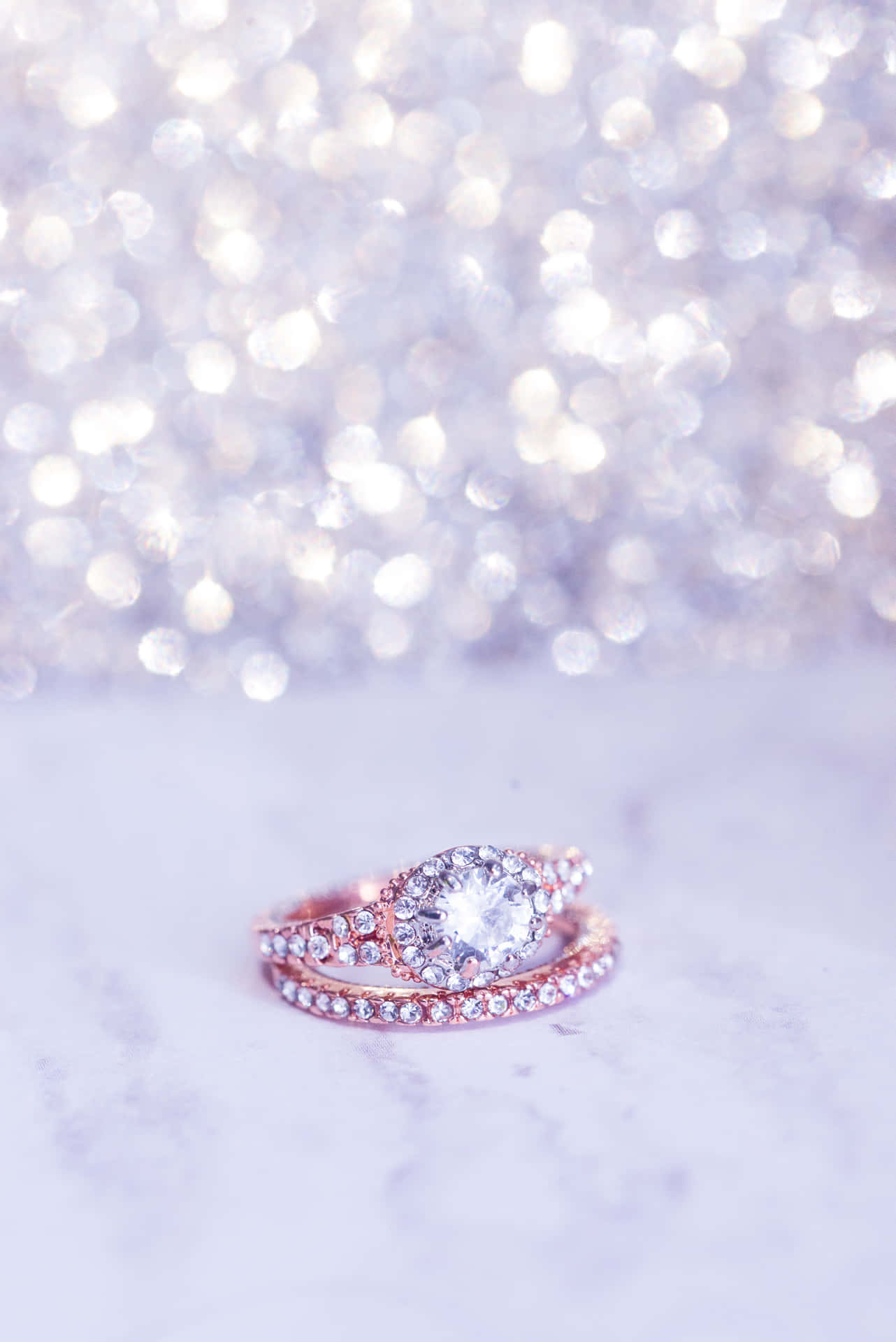 A Rose Gold Engagement Ring With A Diamond In The Middle