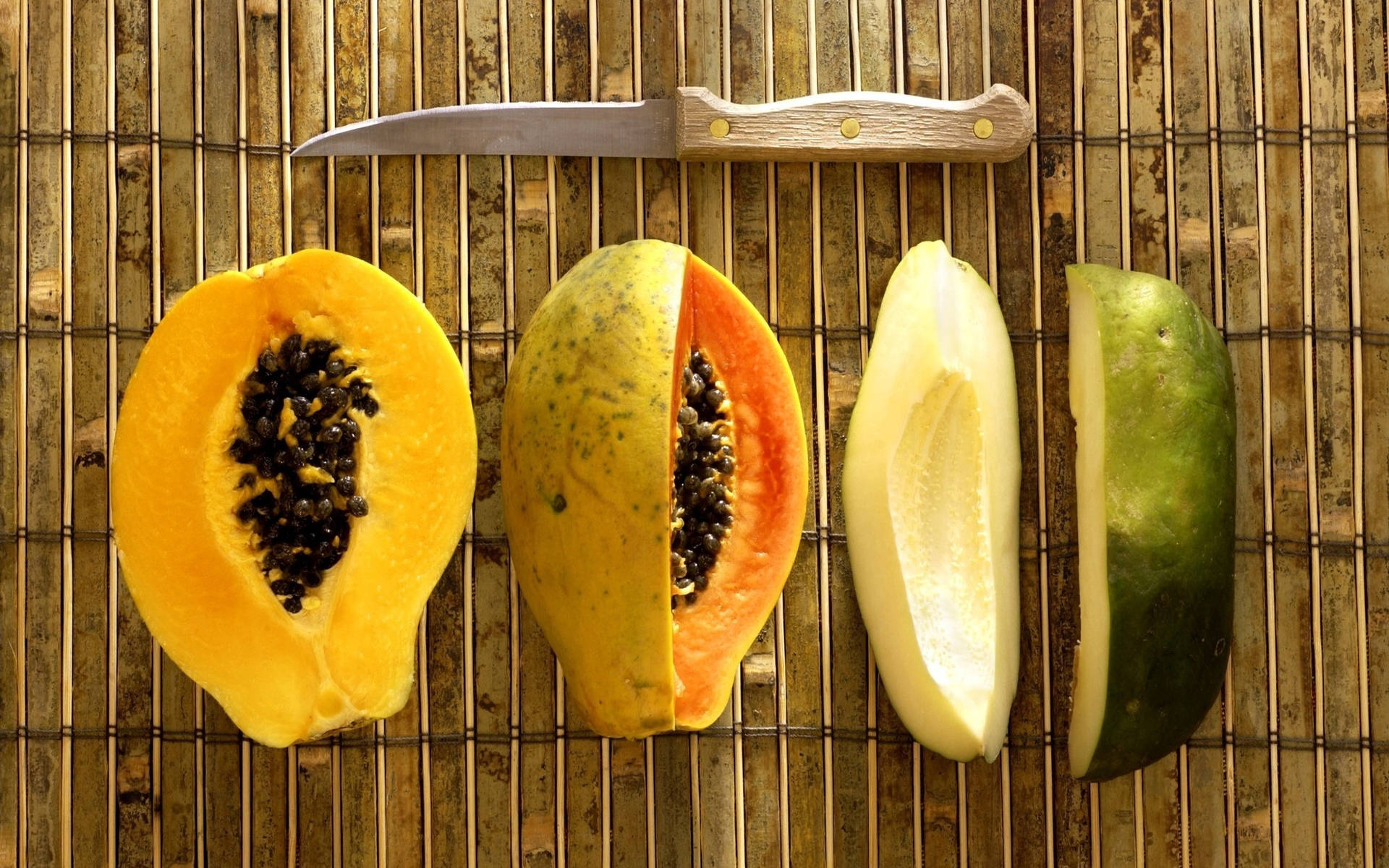 Assorted Ripe and Unripe Papaya Fruits Wallpaper