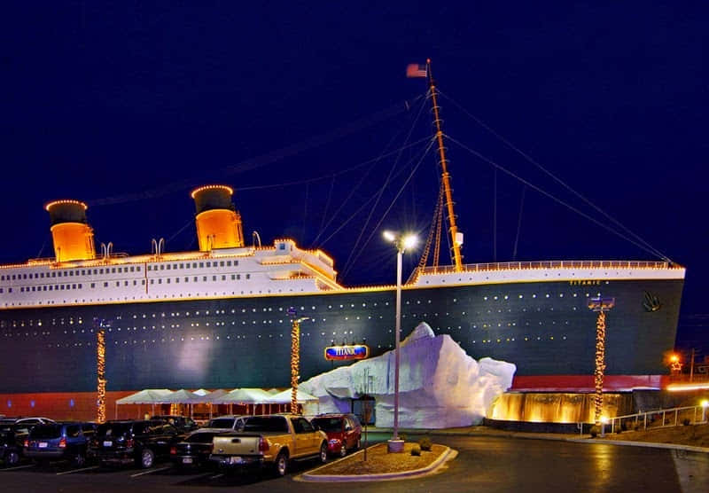 Rms Titanic Museum Under Blue Night Sky Background