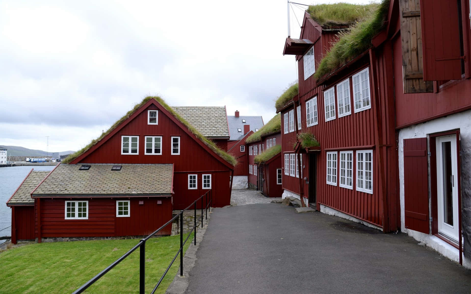 Road In Between Red Houses In Thorshavn Wallpaper