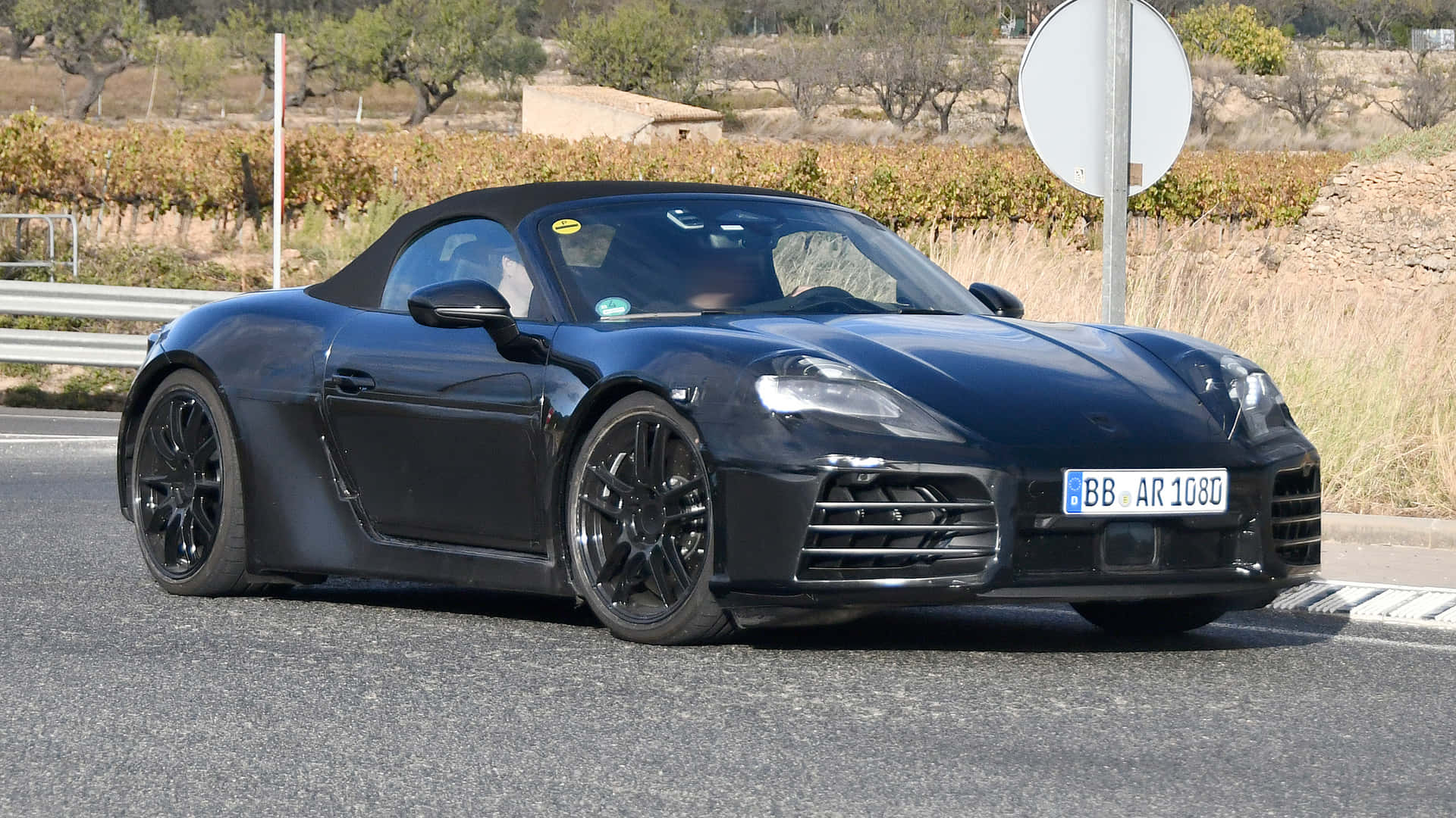 Roaring Porsche Boxster On An Open Highway Wallpaper