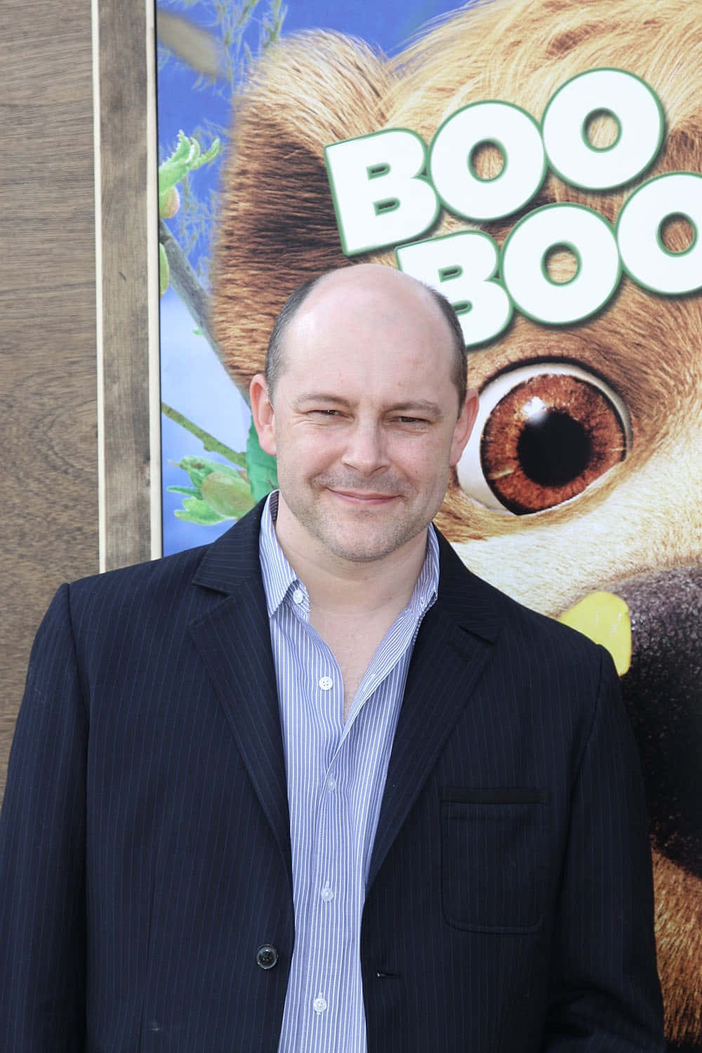 Actor Rob Corddry looks stylish in a formal dress shirt and sunglasses Wallpaper
