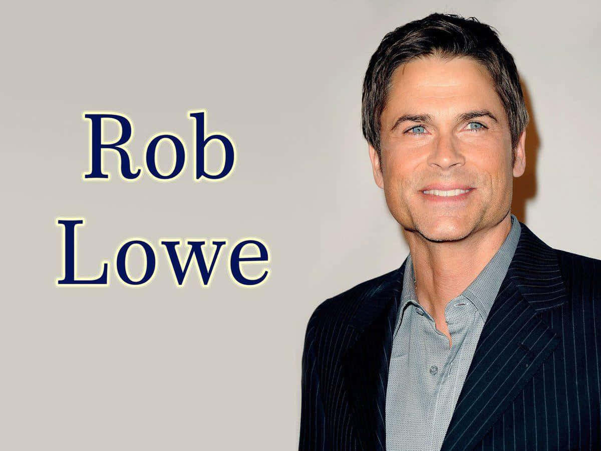 Actor Rob Lowe looks directly at the camera at a press event Wallpaper