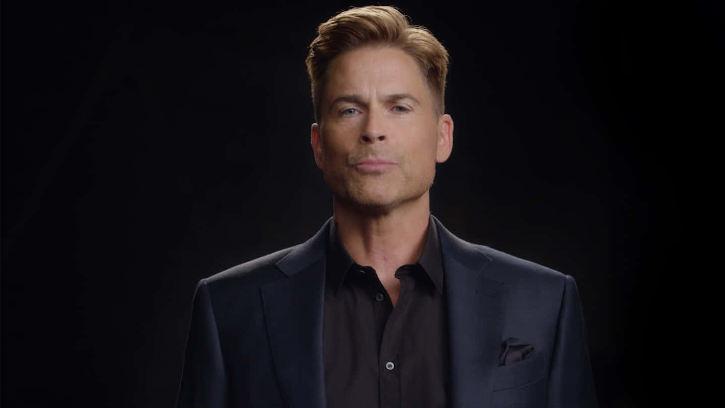 Rob Lowe brings an easy smile and confident stance Wallpaper