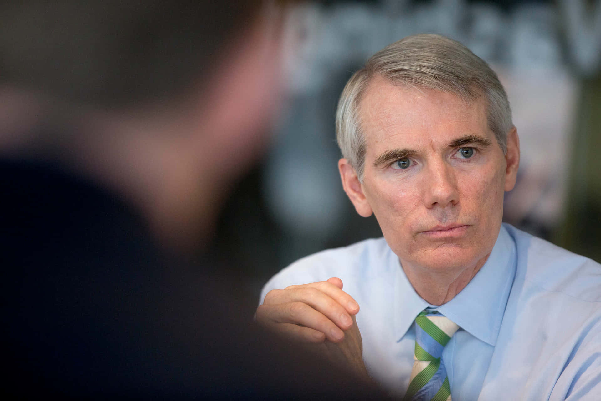 Rob Portman Listening With Hands Clasped Wallpaper